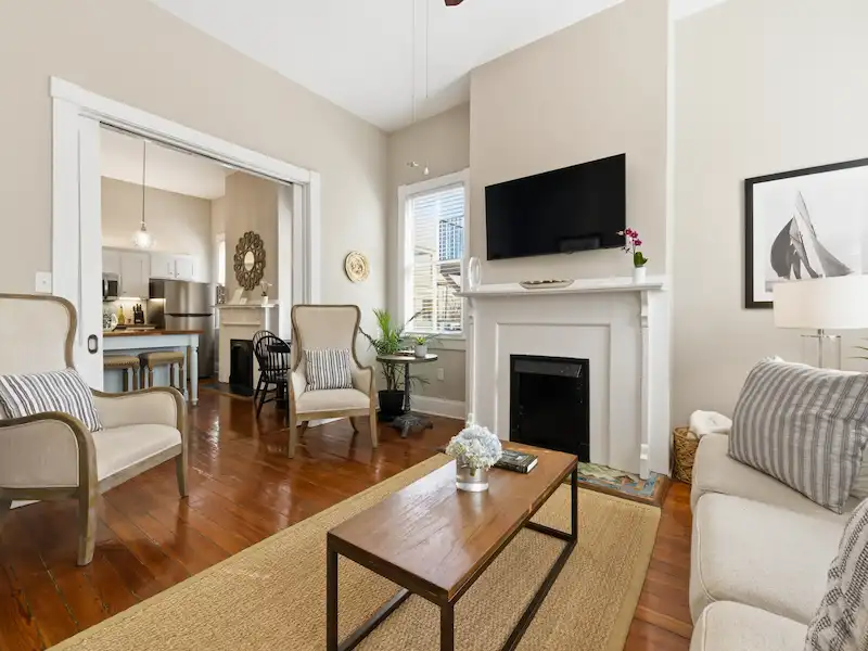 Suite 316A fully stocked kitchen — signature haint blue island with heart-pine floors, Victorian District Savannah vacation rental
