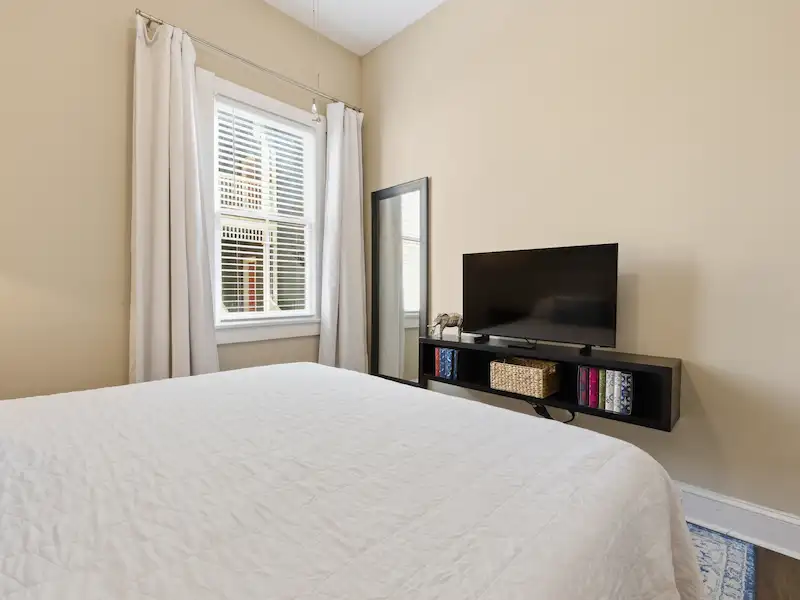 Suite 316A king bedroom with premium linens — Victorian District Savannah vacation rental