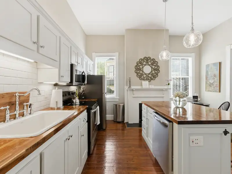 Suite 316A kitchen shaker cabinets with butcher block countertops — Victorian District vacation rental Savannah